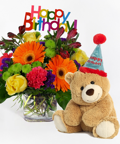 Cube filled with bright gerbera daisies, roses, carnations and more