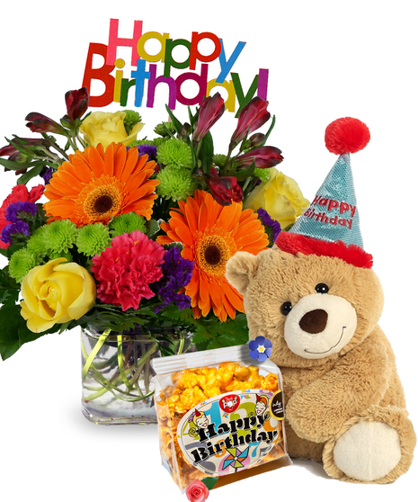 Cube filled with bright gerbera daisies, roses, carnations and more