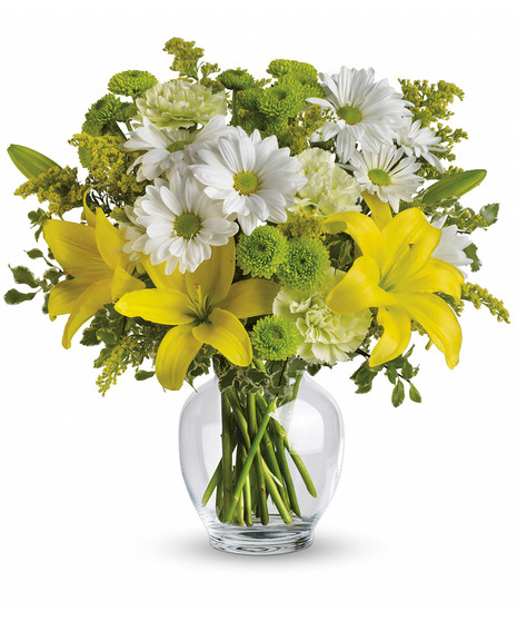 Collection of yellow flowers arranged in a classic ginger jar