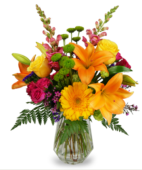 Cube filled with bright gerbera daisies, roses, carnations and more