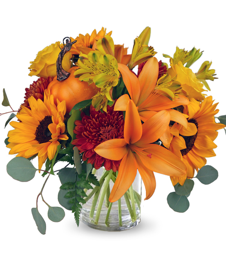 A bouquet of  sunflowers, lilies, alstroemeria, Chrysanthemums, and a pumpkin