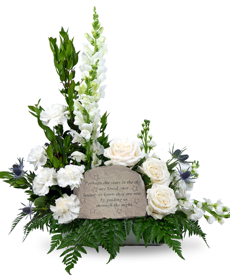 Image shows a stepping stone engraved with the message, 
