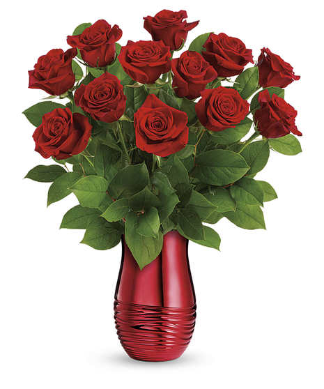 Red roses presented in a rouge ceramic vase