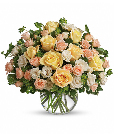 Bubble bowl vase filled with pastel roses and greenery