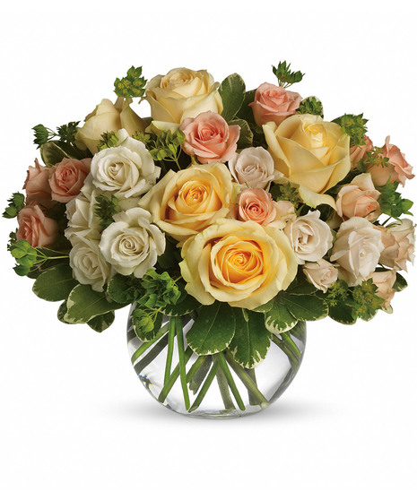 Bubble bowl vase filled with pastel roses and greenery