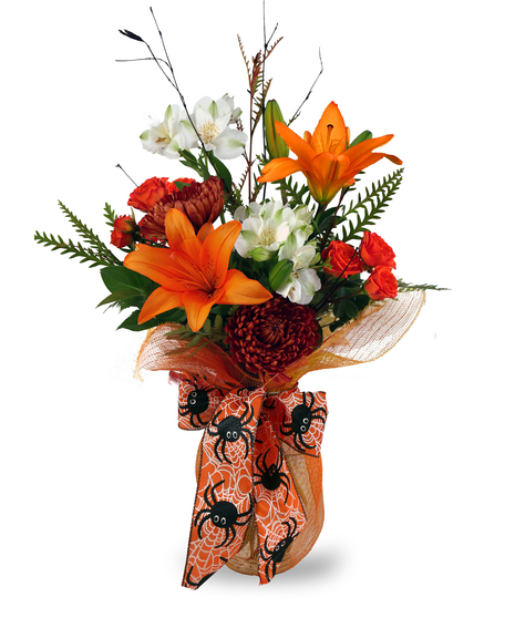 A Halloween-themed fresh floral arrangement featuring orange lilies, orange mums, white alstroemeria, and orange spray roses, arranged in a vase wrapped in orange deco mesh.