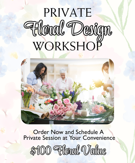 Group of people arranging flowers at a table with roses and greenery during a floral design workshop in a bright studio setting.
